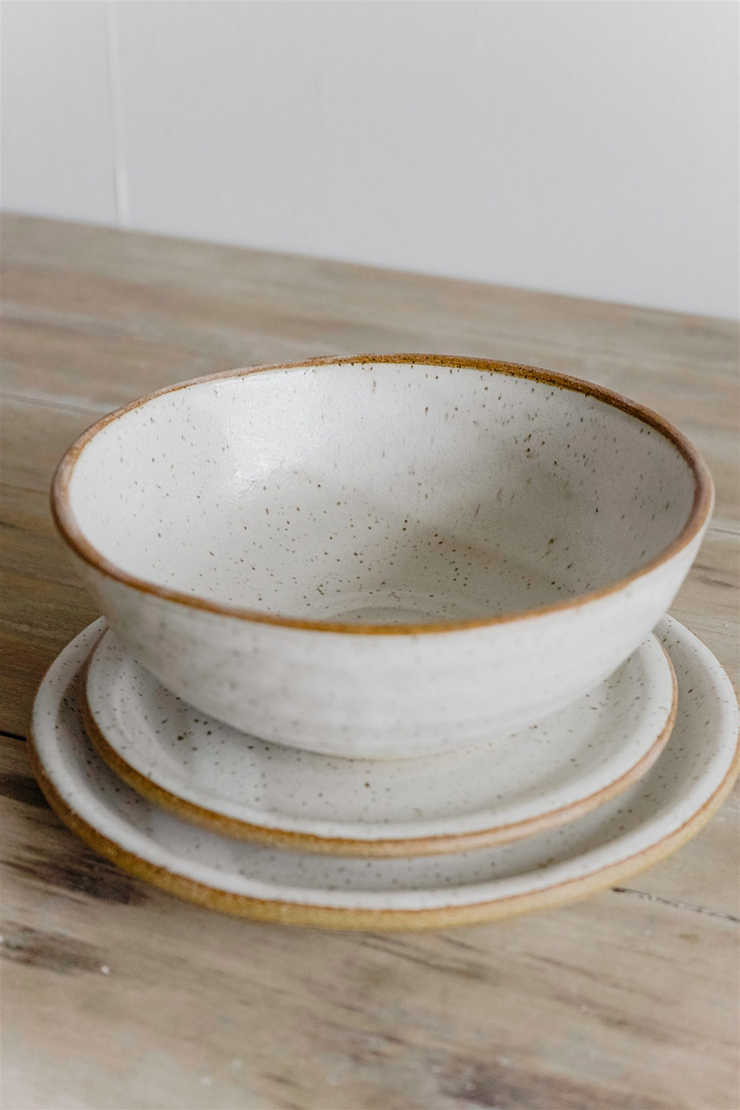 Setting for two outlet handmade stoneware lunch plates and ramen bowls